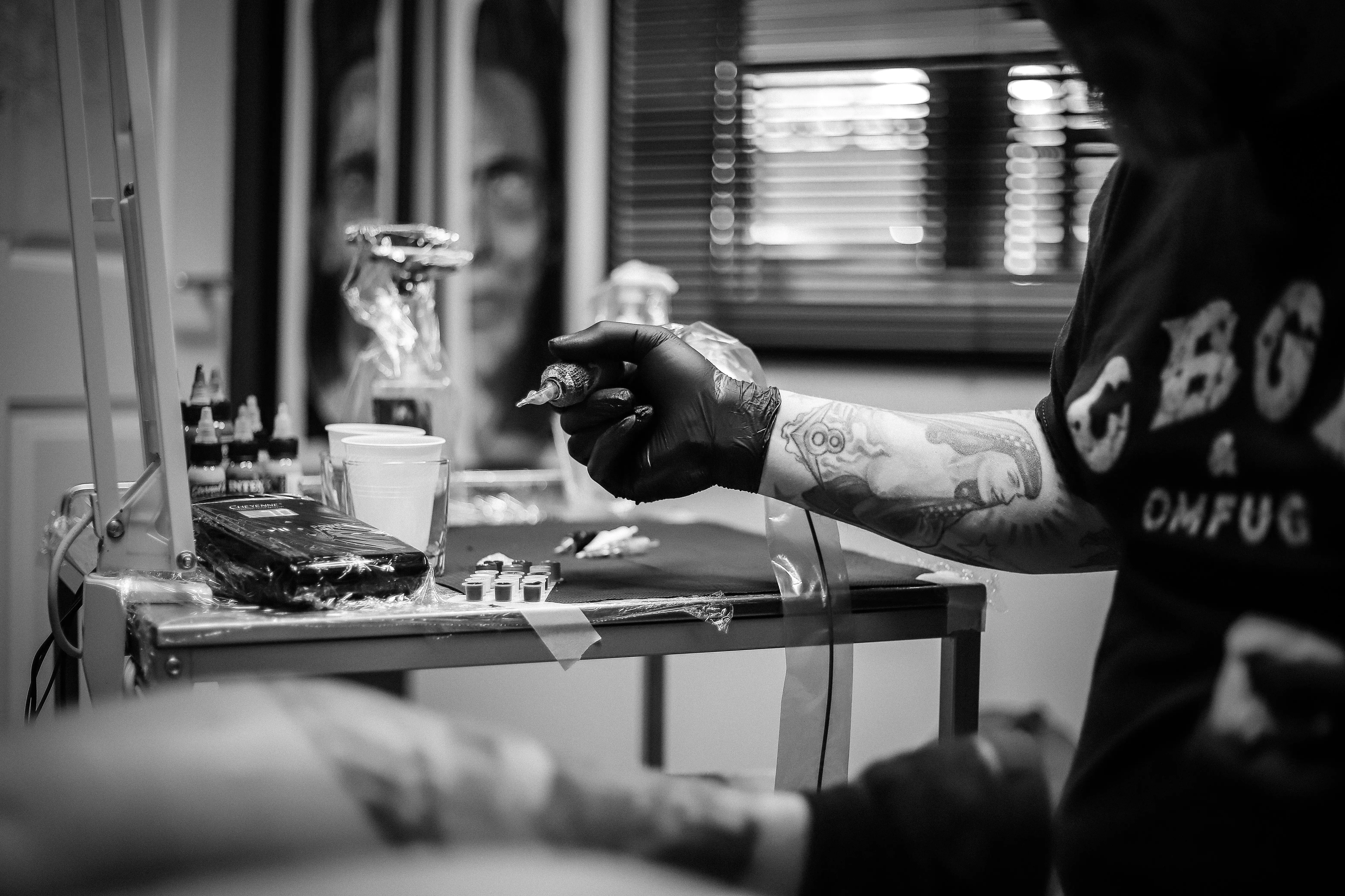 Tattoo artist preparing practice area